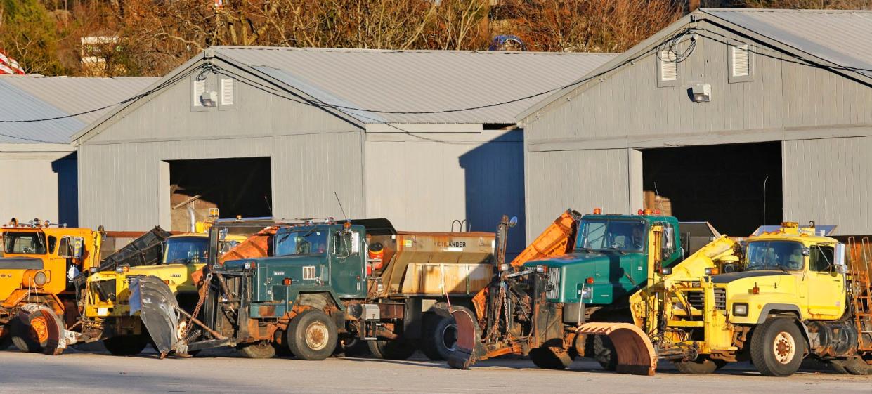 Snow plows on heavy trucks sit at the state DPW yard off Wood Road in Braintree on Friday Jan. 5, 2024/