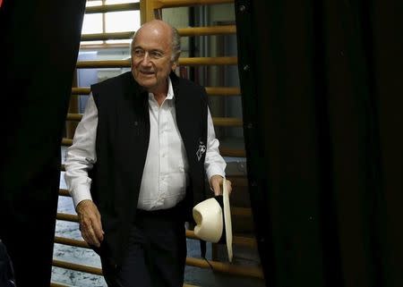 FIFA President Sepp Blatter arrives for a news conference aside of the so-called "Sepp Blatter tournament" in Blatter's home-town Ulrichen, Switzerland, August 22, 2015. REUTERS/Denis Balibouse