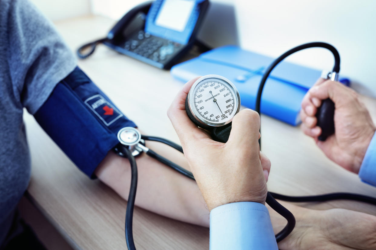 Doctor checking the blood pressure of a patient