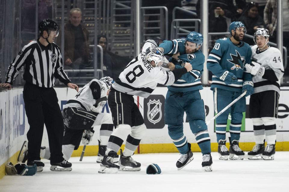 San Jose Sharks center Luke Kunin (11) fights against Los Angeles Kings right wing Alex Laferriere (78) during the third period of an NHL hockey game Wednesday, Dec. 27, 2023, in Los Angeles. (AP Photo/Kyusung Gong)