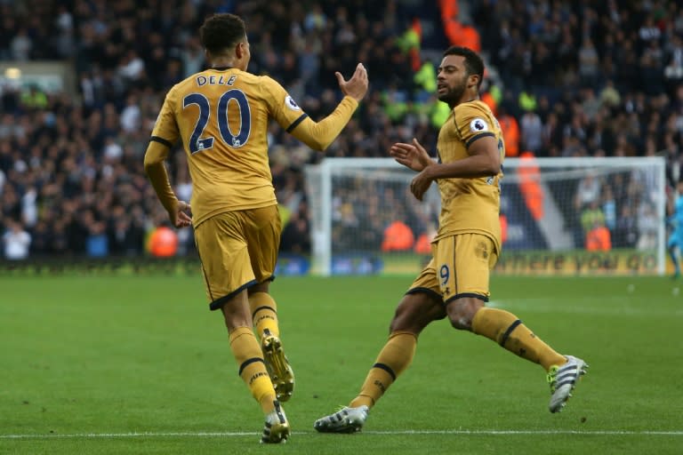 Tottenham Hotspur's Dele Alli (L) celebrates with teammate Mousa Dembele after scoring a goal during their English Premier League match against West Bromwich Albion, at The Hawthorns stadium in West Bromwich, on October 15, 2016