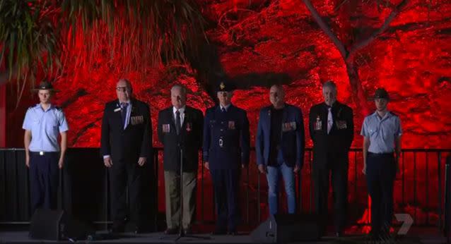 Servicemen past and present stand to pay their respects at Elephant Rock, Currumbin. Source: 7 News