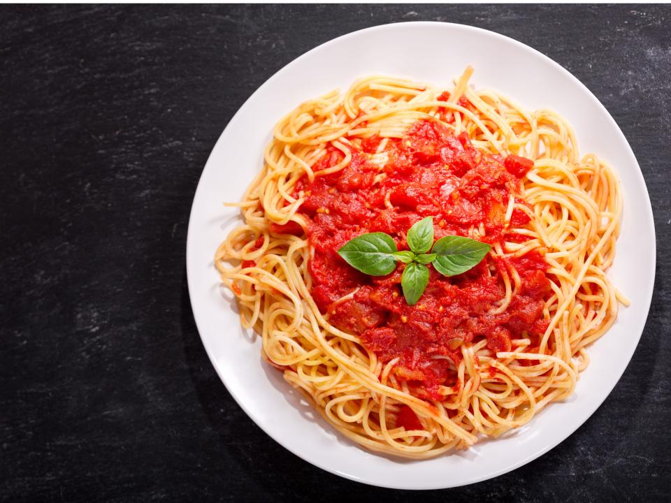 pasta with marinara sauce and basil