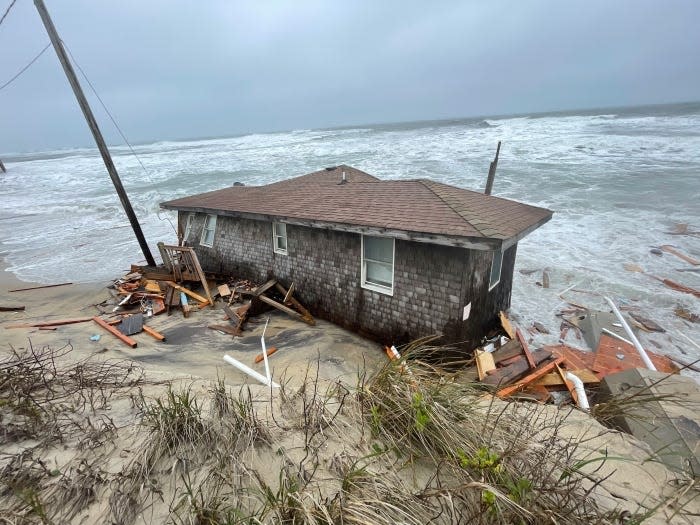 The collapsed one-story house at 23228 East Point Drive, Rodanthe,