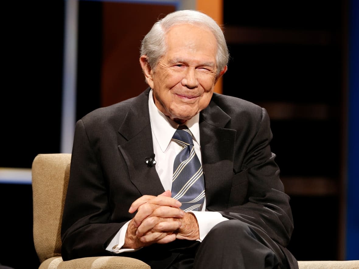 Pat Robertson is shown at an event at Regent University in Virginia Beach, Va., on Oct. 23, 2015. Robertson, a religious broadcaster who turned a small television station into a global media empire, has died at age 93.   (Steve Helber/The Associated Press - image credit)