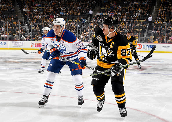 PITTSBURGH, PA - NOVEMBER 8: Sidney Crosby #87 of the Pittsburgh Penguins and Connor McDavid #97 of the Edmonton Oilers skates at PPG Paints Arena on November 8, 2016 in Pittsburgh, Pennsylvania. (Photo by Joe Sargent/NHLI via Getty Images)