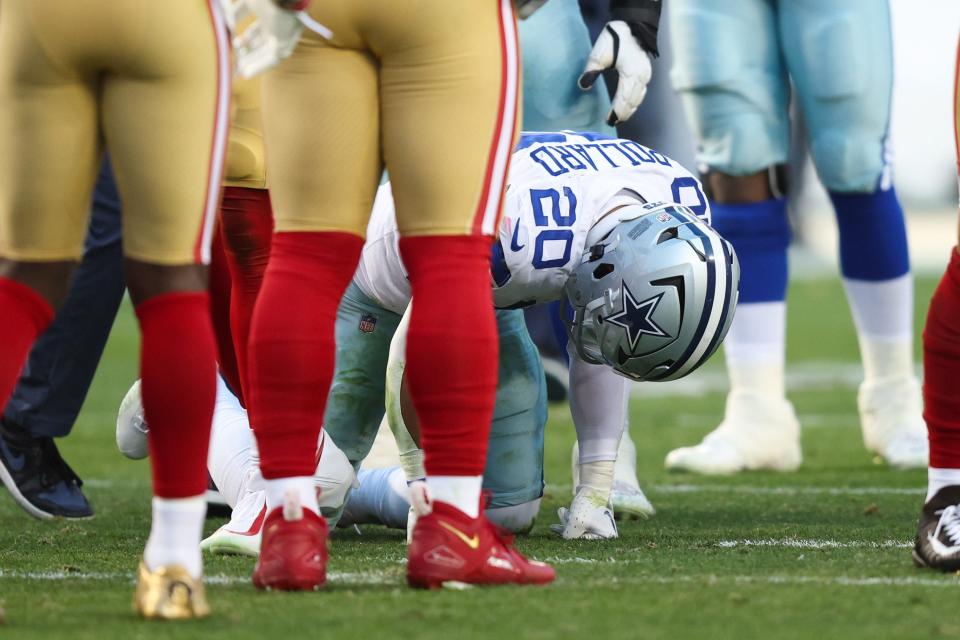 Tony Pollard #20 of the Dallas Cowboys reacts on the field after suffering an injury against the San Francisco 49ers during the first half in the NFC Divisional Playoff game at Levi's Stadium on January 22, 2023 in Santa Clara, California.