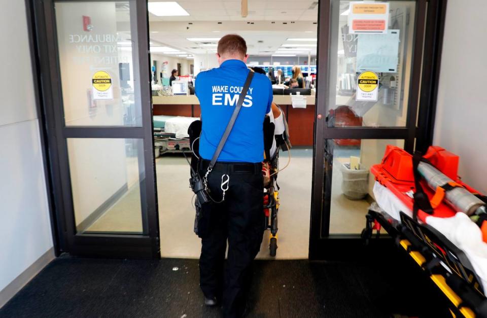 A patient is brought into the emergency department at UNC REX Hospital in Raleigh, N.C., Friday, October 1, 2021.