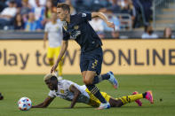 Philadelphia Union's Jack Elliott. right gets the ball past Columbus Crew's Gyasi Zerdes, left during the first half of an MLS soccer match, Wednesday, June 23, 2021, in Chester, Pa. (AP Photo/Chris Szagola)
