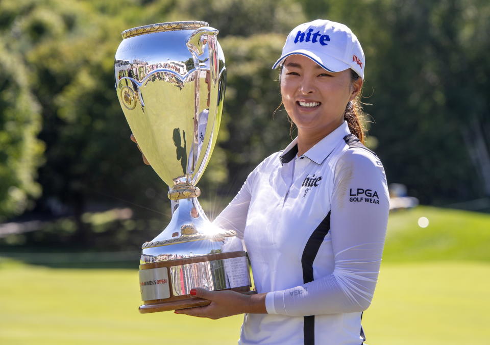 Jin Young Ko of South Korea poses with the trophy after winning the CP Women's Open in Aurora, Ontario, Sunday, Aug. 25, 2019. (Frank Gunn/The Canadian Press via AP)