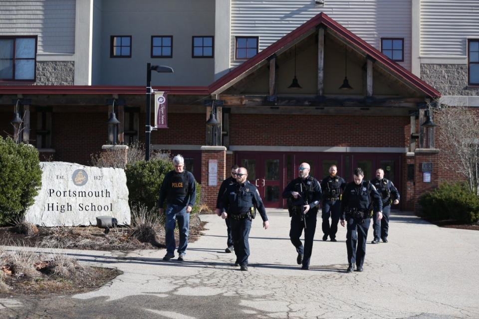 In this Dec. 8, 2022 file photo, Portsmouth police leave Portsmouth High School after responding to a report of an active shooter that is believed to have been a hoax. Police gave the all clear at 11 a.m. and no intruders were found at any of the city's schools.