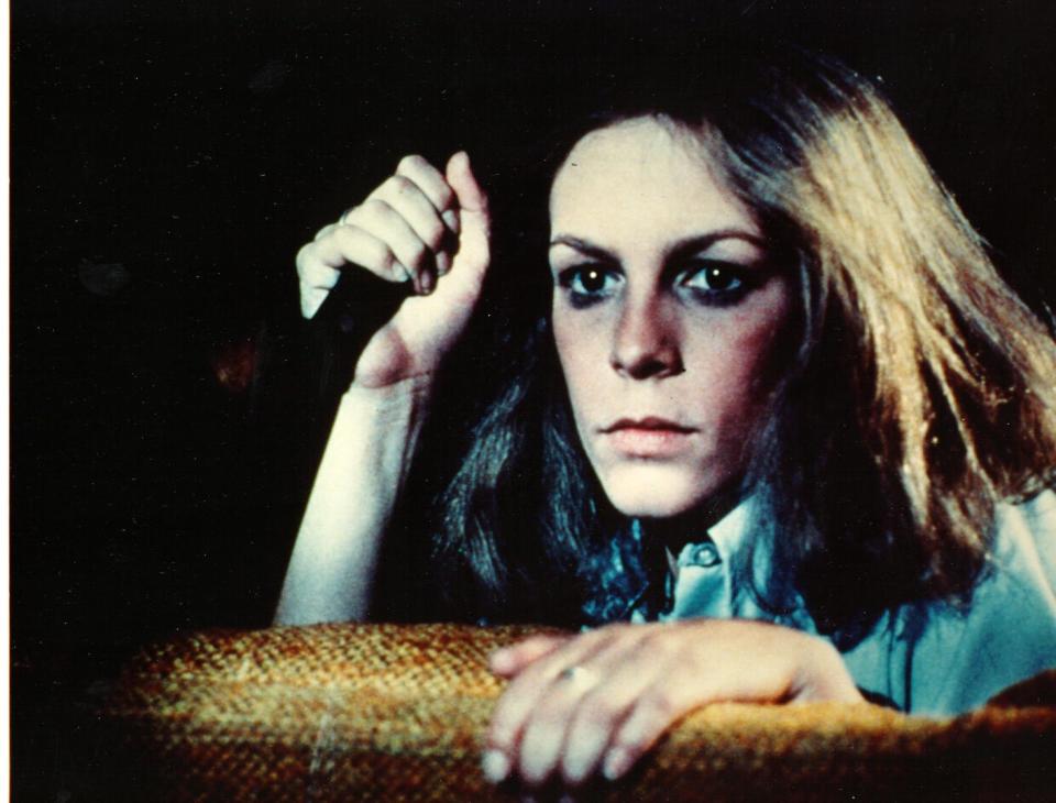 Jamie Lee Curtis wields a knife in the 1978 horror film classic, "Halloween," directed by John Carpenter.  While the actress had performed in TV, this film is considered to be her big break.