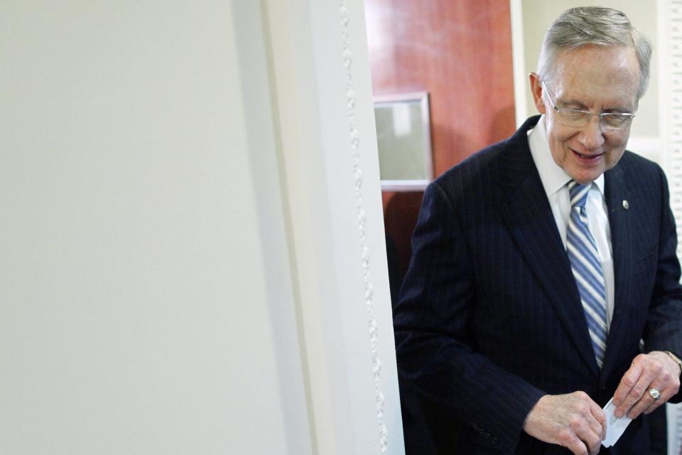 U.S. Senate Majority Leader Harry Reid (D-NV) smiles as he departs a news conference after bipartisan passage of budget and debt legislation at the U.S. Capitol in Washington, October 16, 2013. REUTERS/Jonathan Ernst (UNITED STATES - Tags: POLITICS BUSINESS)