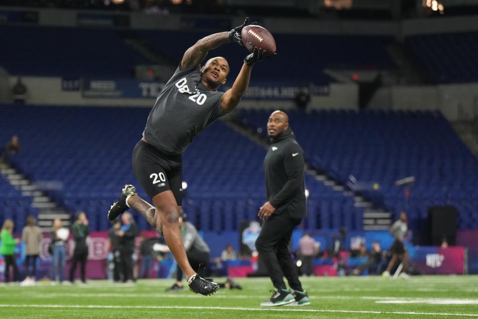 Northwestern defensive back Cameron Mitchell participates in drills