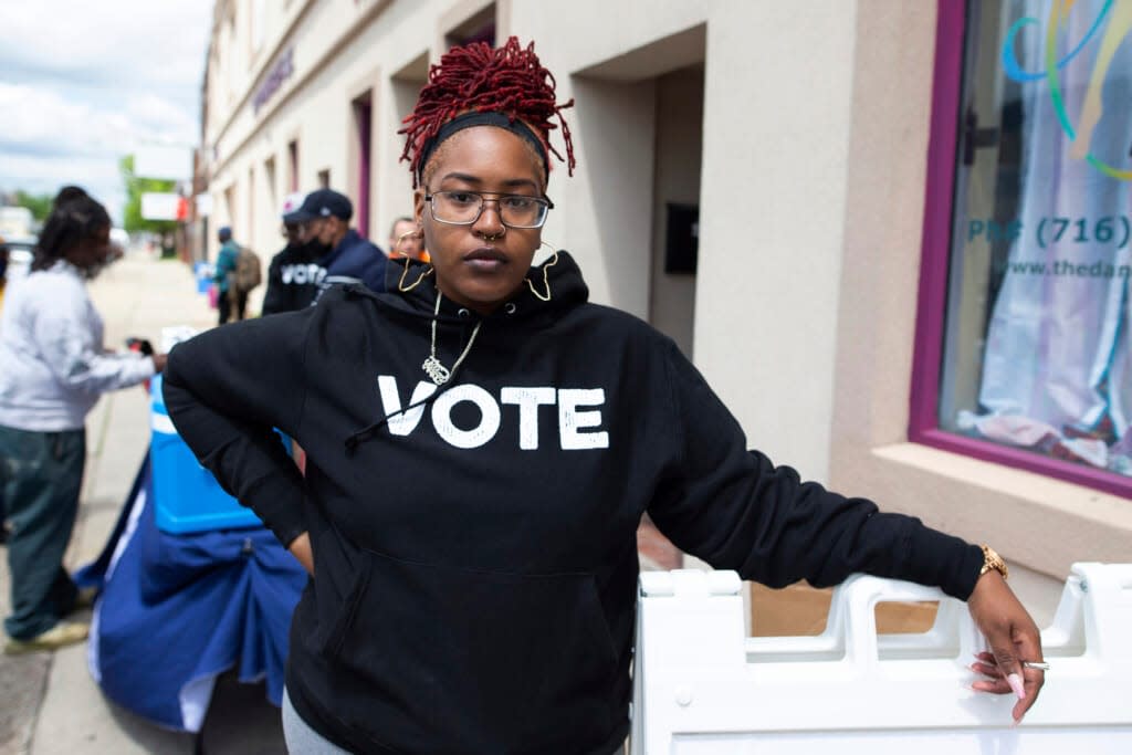 Jillian Hanesworth, with Open Buffalo, poses for a photo, Tuesday, May 17, 2022, in Buffalo, N.Y. “We see how Black and brown people get treated by the police,” she said, that police don’t hesitate to “take deadly action against Black and brown people.” AP Photo/Joshua Bessex, File)