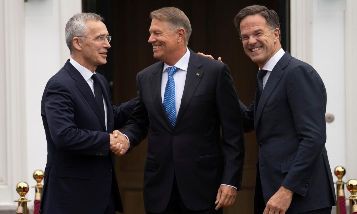 <span>The Romanian president, Klaus Iohannis (centre), who is standing for the post, with Mark Rutte (right) and the current secretary general, Jens Stoltenberg, in June 2023.</span><span>Photograph: Peter Dejong/AP</span>