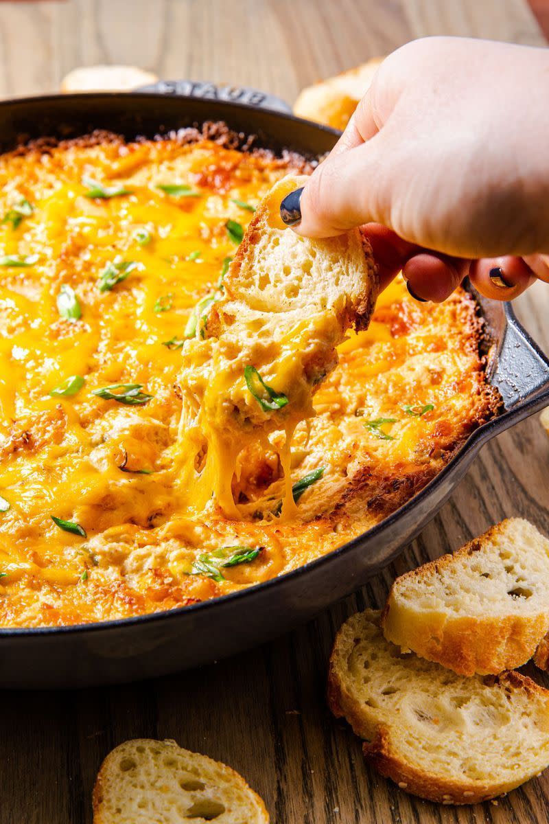<p>In need for a simple dip that will be a huge hit at any party? This is just the dip. A cheesy crab dip that will be gone in a matter of seconds. Serve with plenty of toasted bread!</p><p>Get the <a href="https://www.delish.com/uk/cooking/recipes/a30283219/easy-hot-crab-dip-recipe/" rel="nofollow noopener" target="_blank" data-ylk="slk:Hot Crab Dip;elm:context_link;itc:0" class="link ">Hot Crab Dip</a> recipe.</p>
