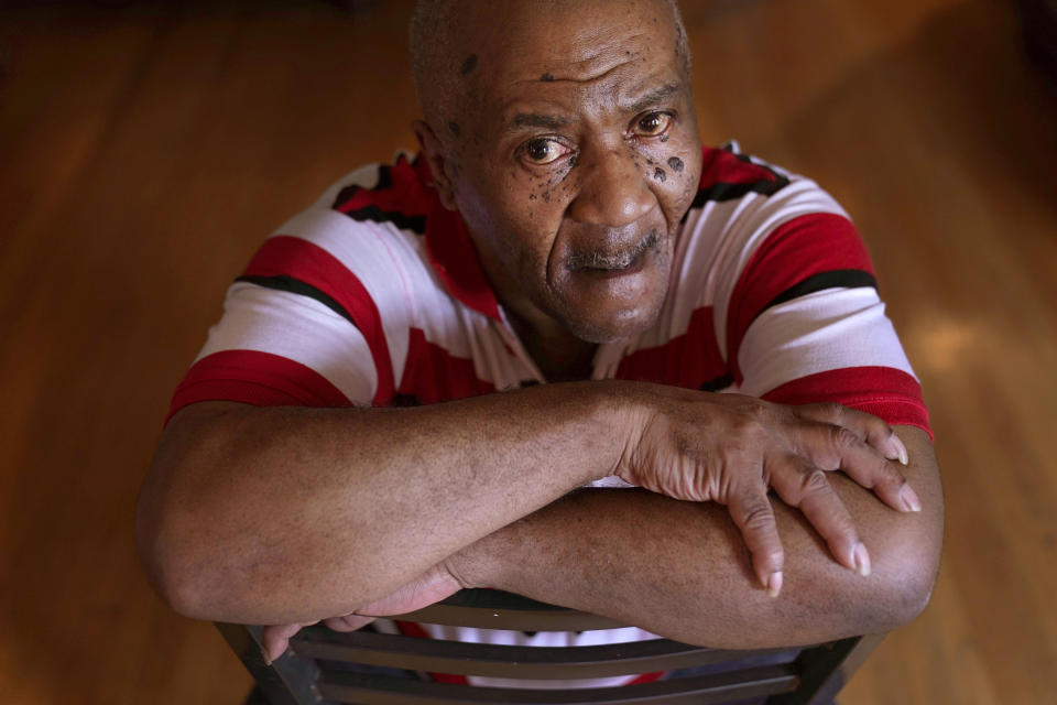 Michael Williams sits for a portrait in his South Side Chicago home Tuesday, July 27, 2021. Williams was behind bars for nearly a year before a judge dismissed the murder case against him in July at the request of prosecutors, who said they had insufficient evidence. (AP Photo/Charles Rex Arbogast)