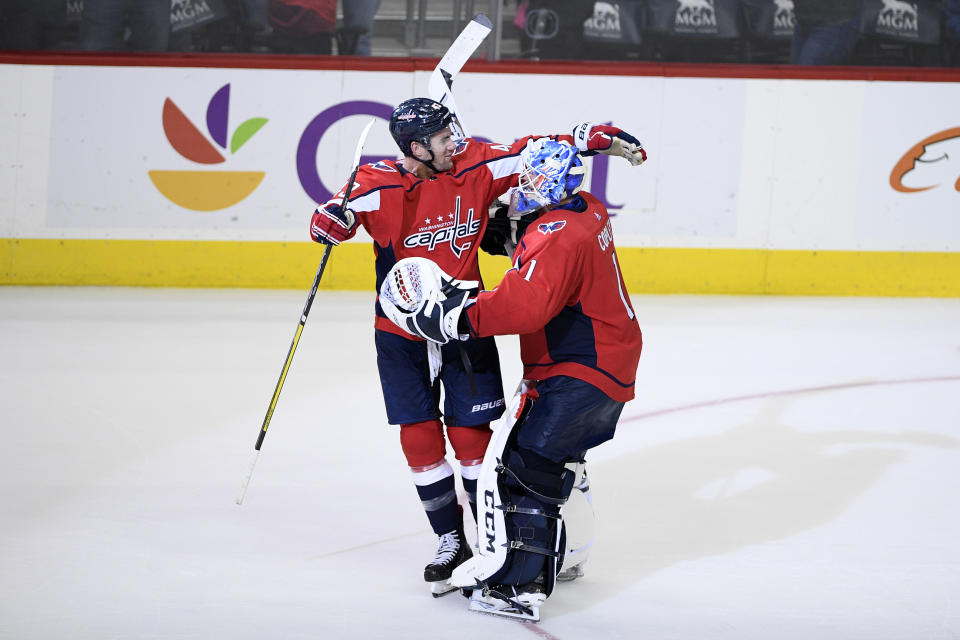 Washington Capitals goaltender Pheonix Copley (1) celebrates with right wing Tom Wilson, left, after an NHL hockey game against the Buffalo Sabres, Saturday, Dec. 15, 2018, in Washington. (AP Photo/Nick Wass)