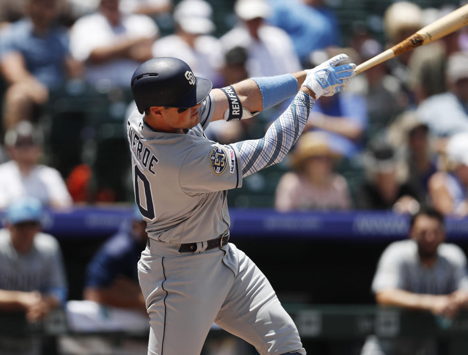 San Diego Padres' Hunter Renfroe connects for a two-run home run off Colorado Rockies starting pitcher Peter Lambert in the first inning of a baseball game Sunday, June 16, 2019, in Denver. (AP Photo/David Zalubowski)