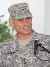 FILE PHOTO: U.S. military officer Lieutenant. General Robert L. Caslen speaks during a ceremony at Camp Prosperity in Baghdad October 1, 2011. REUTERS/Mohammed Ameen/File Photo