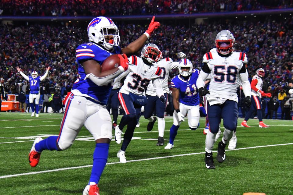 Buffalo Bills running back Devin Singletary scores a touchdown during the second quarter against the New England Patriots at Highmark Stadium.