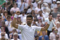 Serbia's Novak Djokovic celebrates defeating Australia's Thanasi Kokkinakis in a singles tennis match on day three of the Wimbledon tennis championships in London, Wednesday, June 29, 2022. (AP Photo/Alastair Grant)