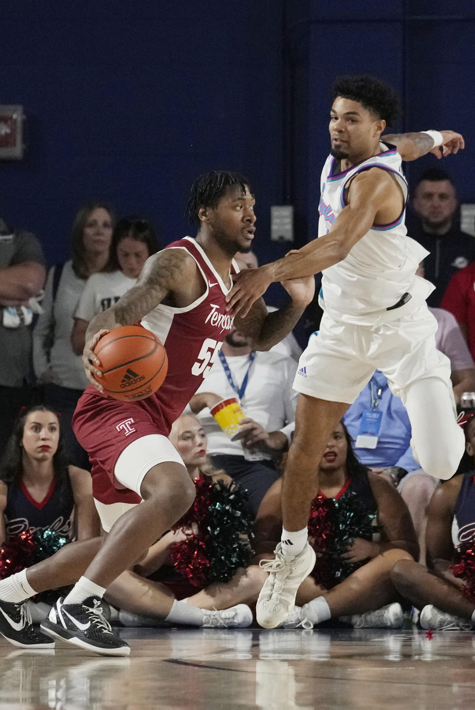 Florida Atlantic guard Nicholas Boyd defends Temple guard Shane Dezonie (55) during the first half of an NCAA college basketball game, Thursday, Feb. 15, 2024, in Boca Raton, Fla. (AP Photo/Marta Lavandier)