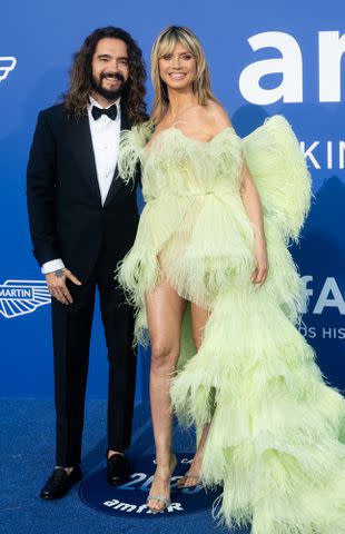 <p>Samir Hussein/WireImage</p> Tom Kaulitz and Heidi Klum attend the amfAR Cannes Gala 2023