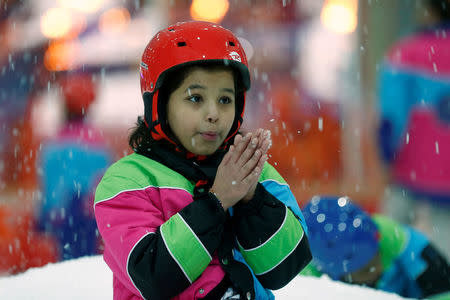 REFILE - QUALITY REPEAT A Saudi girl enjoys snow in the new Snow City at Al Othaim Mall in Riyadh, Saudi Arabia July 26, 2016. Picture taken July 26, 2016. REUTERS/Faisal Al Nasser