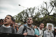 Moroccans chant slogans as they take part in a demonstration in Rabat, Morocco, Sunday, April 21, 2019. Protesters are condemning prison terms for the leader of the Hirak Rif protest movement against poverty and dozens of other activists. (AP Photo/Mosa'ab Elshamy)