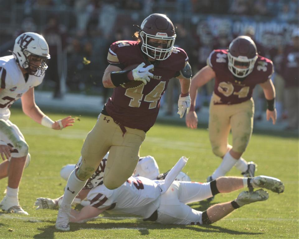 Killingly senior Keith Perry eyes the end zone against North Haven in the Class MM championship game.