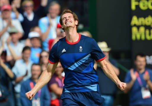 Great Britain's Andy Murray celebrates after winning the men's singles gold medal match of the London 2012 Olympic Games by defeating Switzerland's Roger Federer, at the All England Tennis Club in Wimbledon, southwest London
