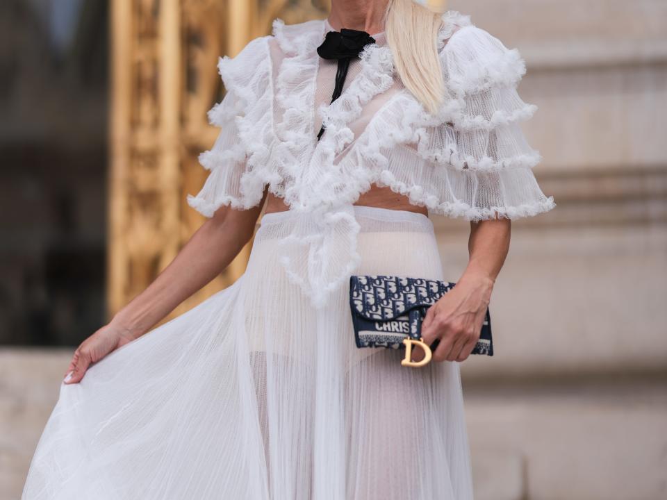 Denisa Palsha in a white, flowy dress.