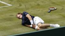 Tennis - Great Britain v France - Davis Cup World Group Quarter Final - Queen?s Club, London - 18/7/15 Great Britain's Andy Murray slips during his doubles match Action Images via Reuters / Andrew Boyers Livepic