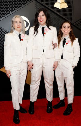 <p>Frazer Harrison/Getty</p> Phoebe Bridgers, Lucy Dacus, and Julien Baker of 'boygenius' attend the 66th GRAMMY Awards at Crypto.com Arena on February 04, 2024 in Los Angeles, California