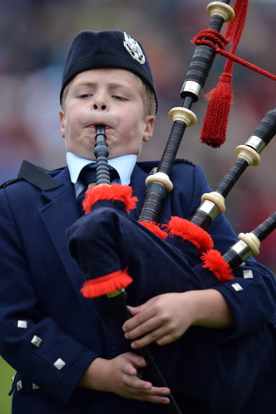 Perth and Kinross pipe band play at the Braemar Highland Games at The Princess Royal and Duke of Fife Memorial Park on September 1, 2012 in Braemar, Scotland. The Braemar Gathering is the most famous of the Highland Games and is known worldwide. Each year thousands of visitors descend on this small Scottish village on the first Saturday in September to watch one of the more colorful Scottish traditions. The Gathering has a long history and in its modern form it stretches back nearly 200 years. (Photo by Jeff J Mitchell/Getty Images)