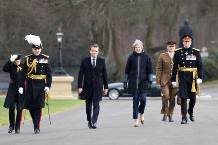 France's President Emmanuel Macron and Britain's Prime Minister Theresa May arrive at Sandhurst Military Academy, Britain, January 18, 2018. REUTERS/Stefan Rousseau/Pool