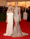  <p class="MsoNormal">Rachel Zoe (left) showed off her handiwork on model Karolina Kurkova, who donned one of Rachel’s pieces – a long-sleeve gold sequin gown with a train and matching turban – from the Rachel Zoe Collection. The celebrity stylist wore one of her own creations too … but didn’t look quite as dramatic as Karolina!</p>