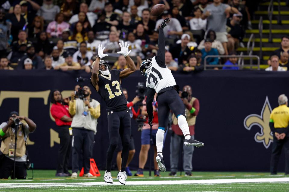 Jacksonville Jaguars cornerback Darious Williams (31) deflects a pass intended for New Orleans Saints receiver Michael Thomas (13) in the Jaguars' 31-24 victory. Williams, a Creekside High product, leads the NFL with 14 pass breakups.