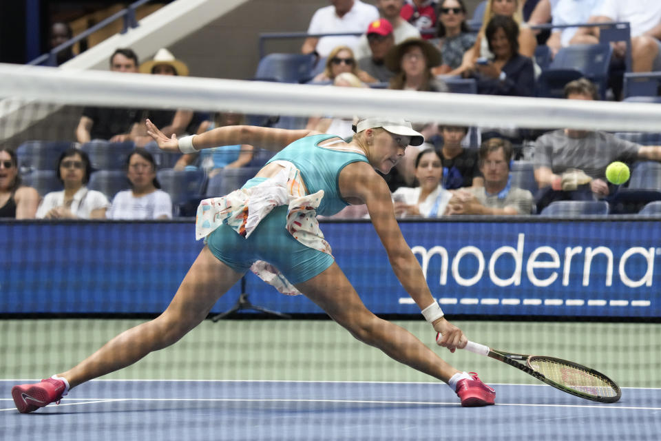 Mirra Andreeva, of Russia, returns a shot to Coco Gauff, of the United States, during the second round of the U.S. Open tennis championships, Wednesday, Aug. 30, 2023, in New York. (AP Photo/John Minchillo)