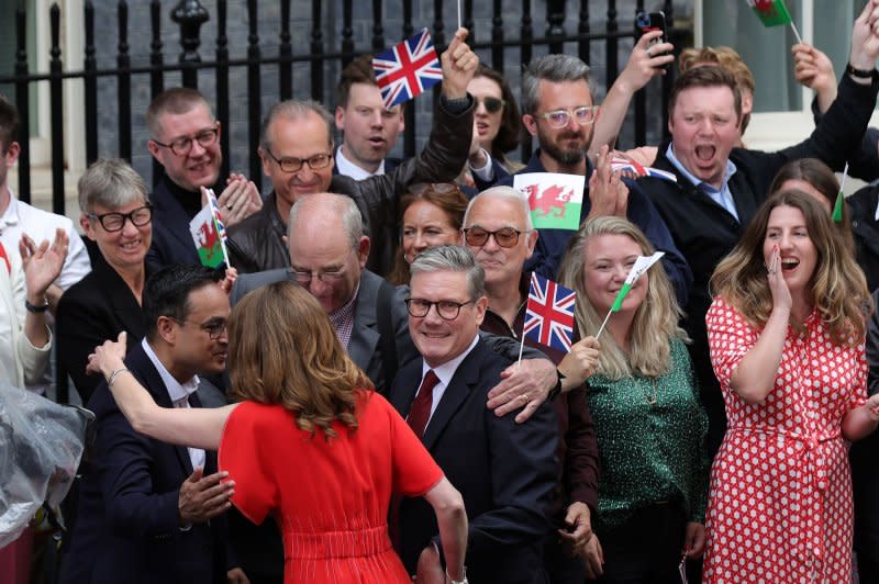 Newly appointed British Prime Minister Sir Keir Starmer and his wife Victoria pose meet friends and party activists outside No.10 Downing Street in London on Friday. Photo by Hugo Philpott/UPI