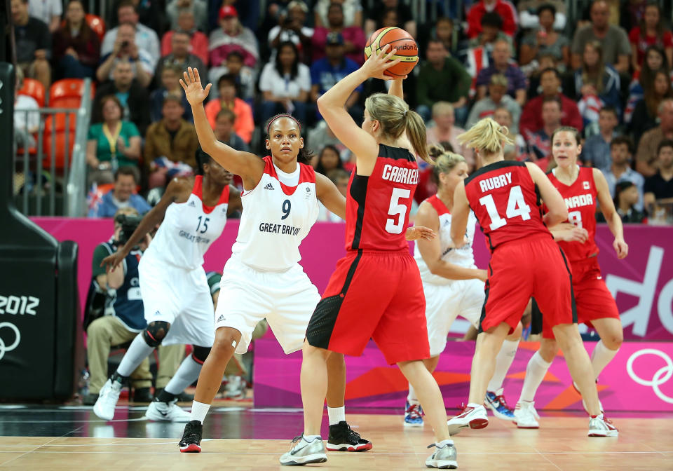 LONDON, ENGLAND - JULY 30: Jenaya Wade-Fray #9 of Great Britain defends against the pass from Teresa Gabriele #5 of Canada during the Women's Basketball Preliminary Round match on Day 3 at Basketball Arena on July 30, 2012 in London, England. (Photo by Christian Petersen/Getty Images)