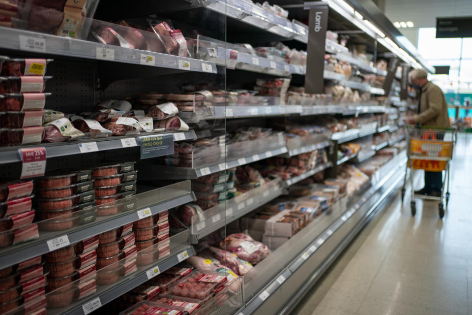 A shopper walks through the fresh meat aisle in a branch of Waitrose in south London. Shoppers are said to be buying a raft of Christmas items, such as presents and frozen turkeys, early in a bid to make sure their festive celebrations are not heavily disrupted for a second year. Picture date: Friday October 15, 2021.