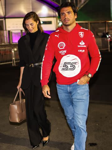 <p>Kym Illman/Getty</p> Carlos Sainz and Rebecca Donaldson enter the paddock during practice ahead of the F1 Grand Prix of Las Vegas on November 16, 2023.