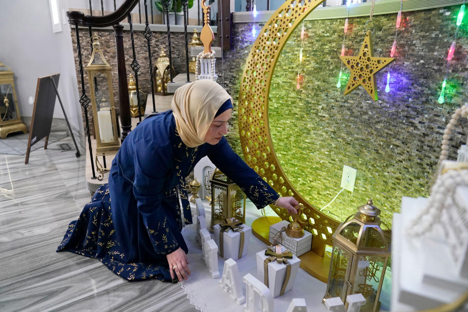 Suzanne Jaber of The Eid Shop looks at some of her company’s Ramadan decorations she created, in Dearborn Heights, Mich., on March 27, 2023.<span class="copyright">Carlos Osorio—AP</span>