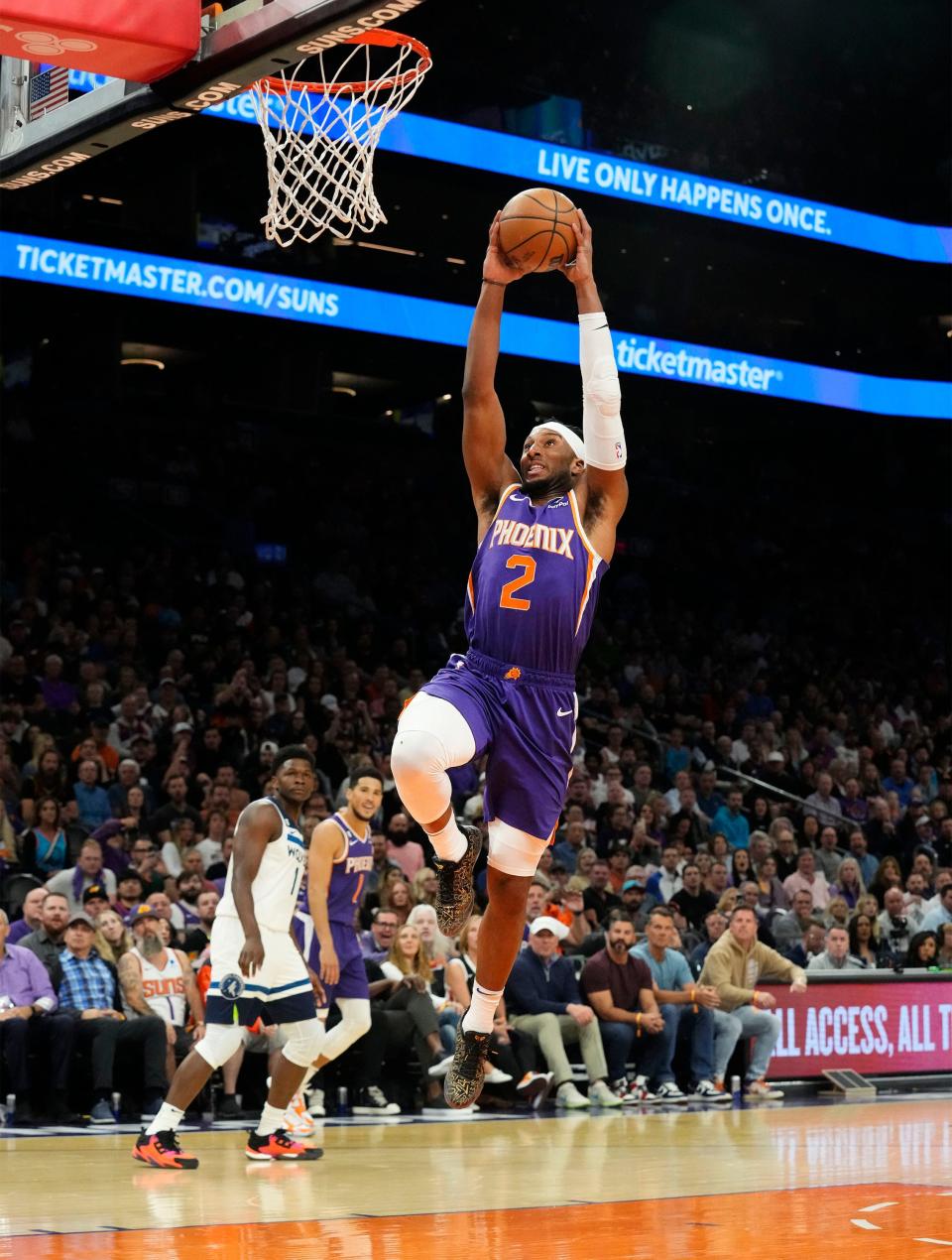Phoenix Suns forward Josh Okogie (2) drives to the basket against the Minnesota Timberwolves in the first half at Footprint Center in Phoenix on March 29, 2023.
