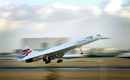 FILE PHOTO: The last British Airways passenger Concorde flight lands at London's Heathrow airport from New York, October 24, 2003. REUTERS/Stephen Hird/File Photo