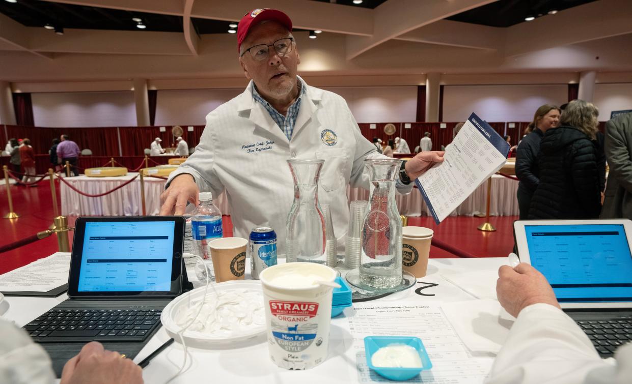 Assistant chief judge Tim Czmowski is summoned by judge for a consultation at the World Cheese Championships.