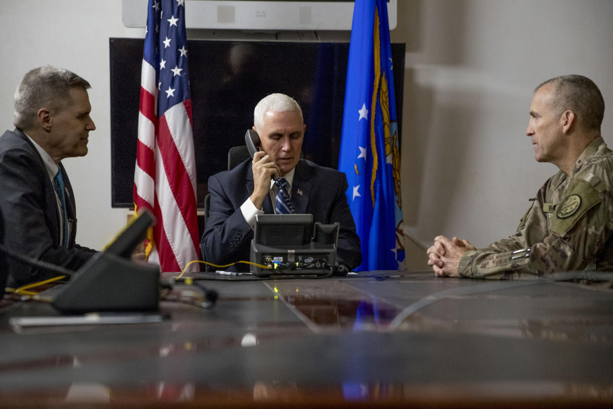 FILE - In this Nov. 23, 2019, file photo Vice President Mike Pence, accompanied by U.S. Ambassador to Iraq Matthew Tueller, left, and Lt. Gen. Pat White, right, takes a phone call with Iraqi Prime Minister Adil Abdul-Mahdi at Al Asad Air Base, Iraq. White is the Fort Hood commander and he is facing the grim task of rebuilding trust and turning around an installation that has one of the highest rates of murder, sexual assault and harassment in the Army. (AP Photo/Andrew Harnik, File)